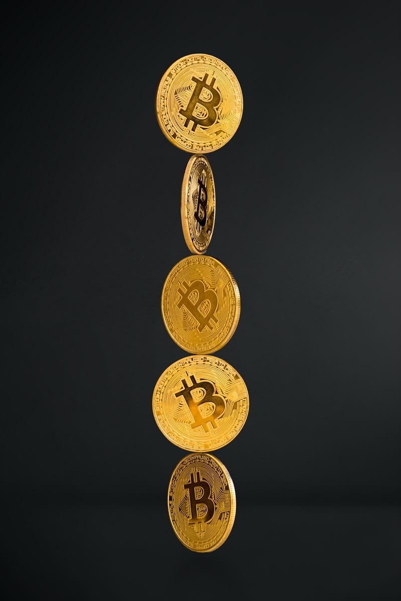 gold round coins on black background