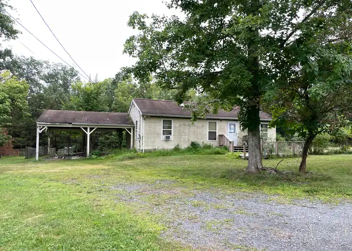 an old, unkempt ranch in need of many repairs