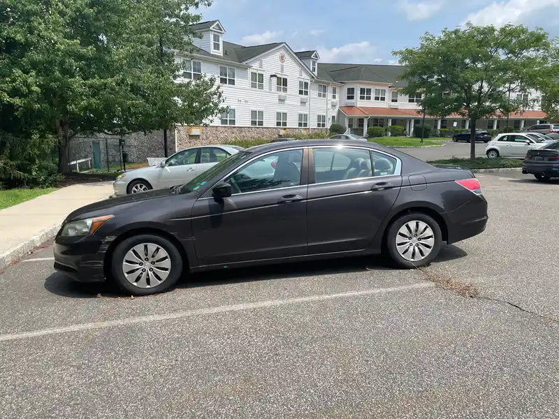 a car parked in front of the apartment building