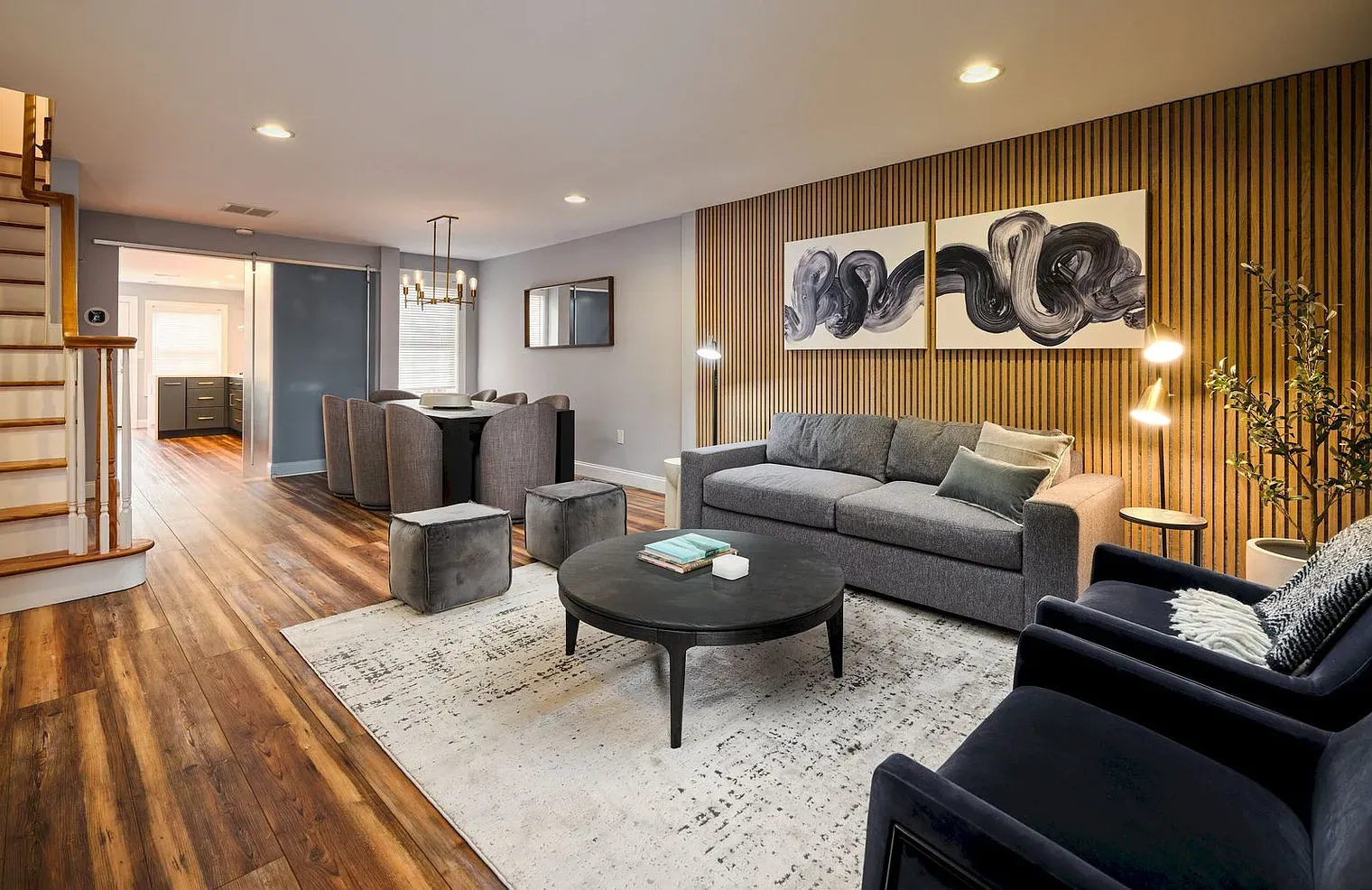 a modern living room with new furniture and new floors