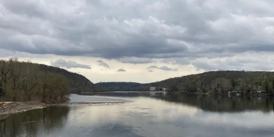 the river with clouds in the sky