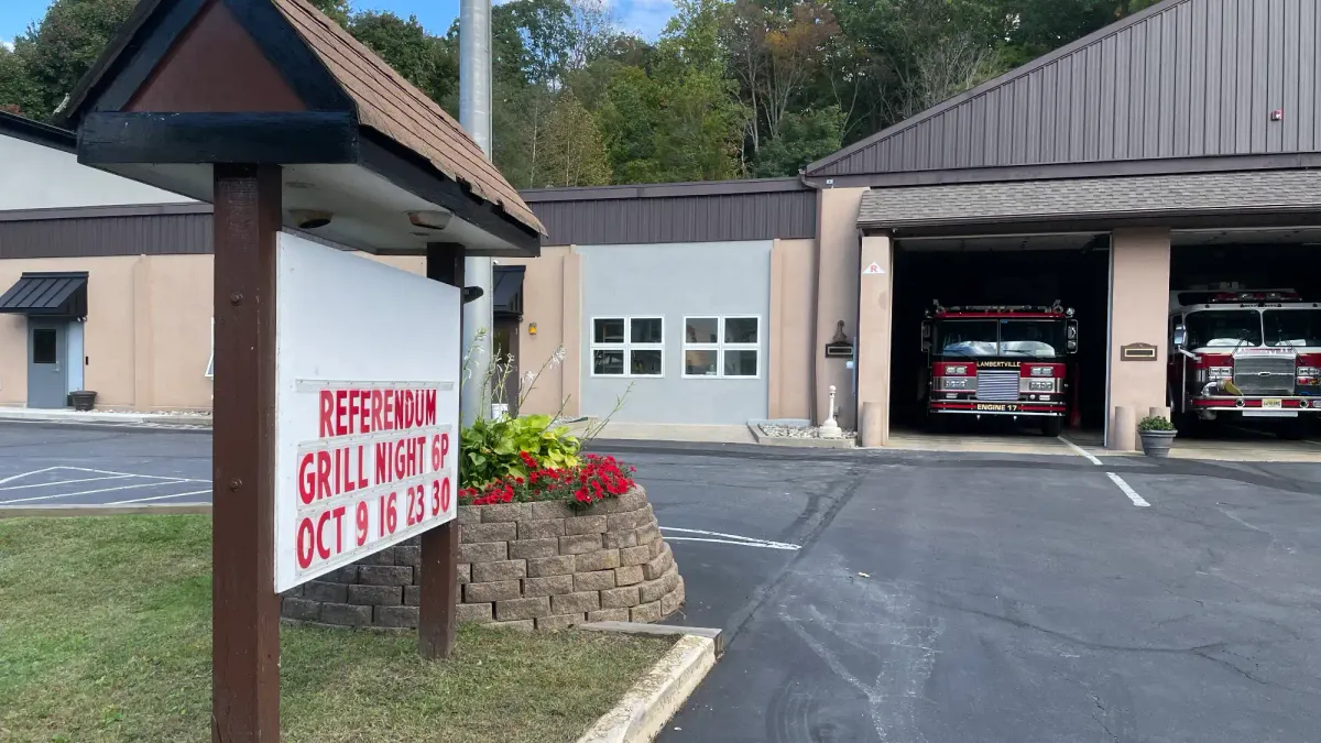 the facade of the fire department building with a sign advertising their upcoming grill nights