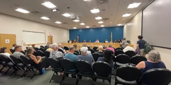 a group of citizens communicating with the city council