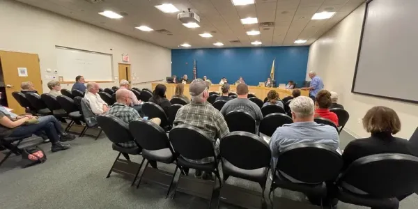 people gathered at the city council meeting