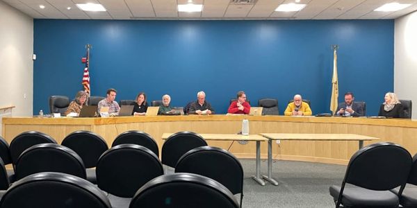the affordable housing advisory committee sitting and talking