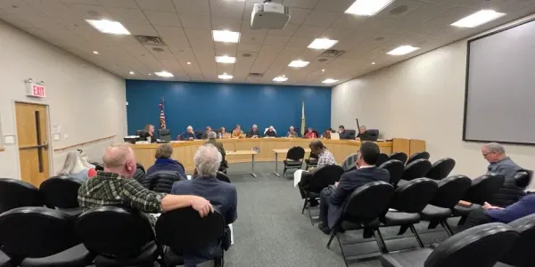 people sitting and listening at the Planning Board Meeting