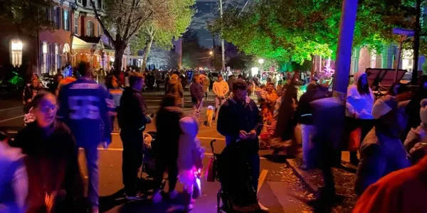 hundred of people in costumes, walking on the streets of Lambertville, NJ