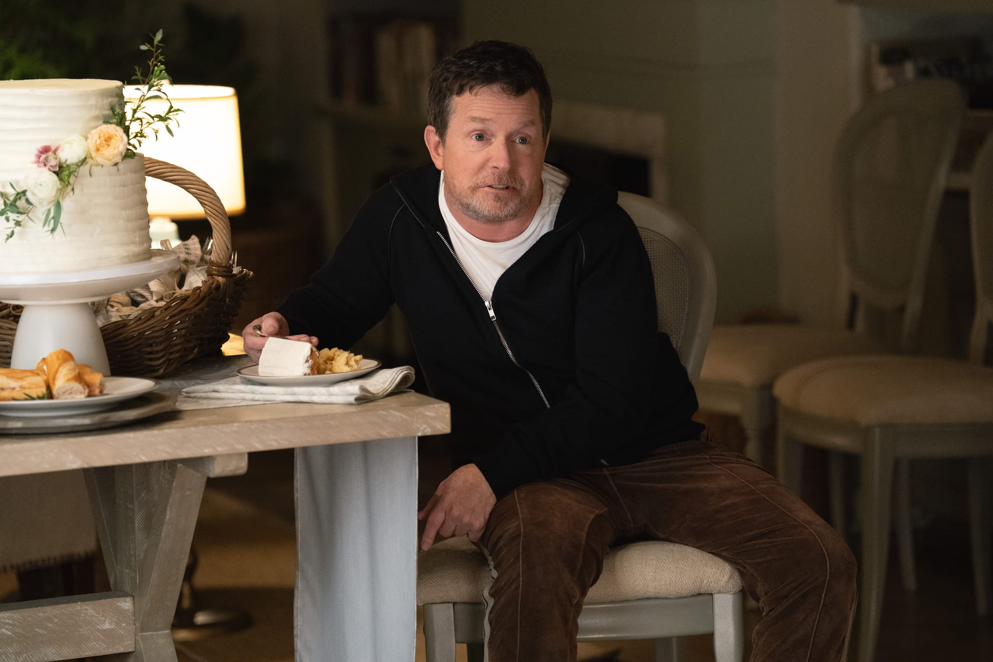 Michael J. Fox eats a slice of wedding cake