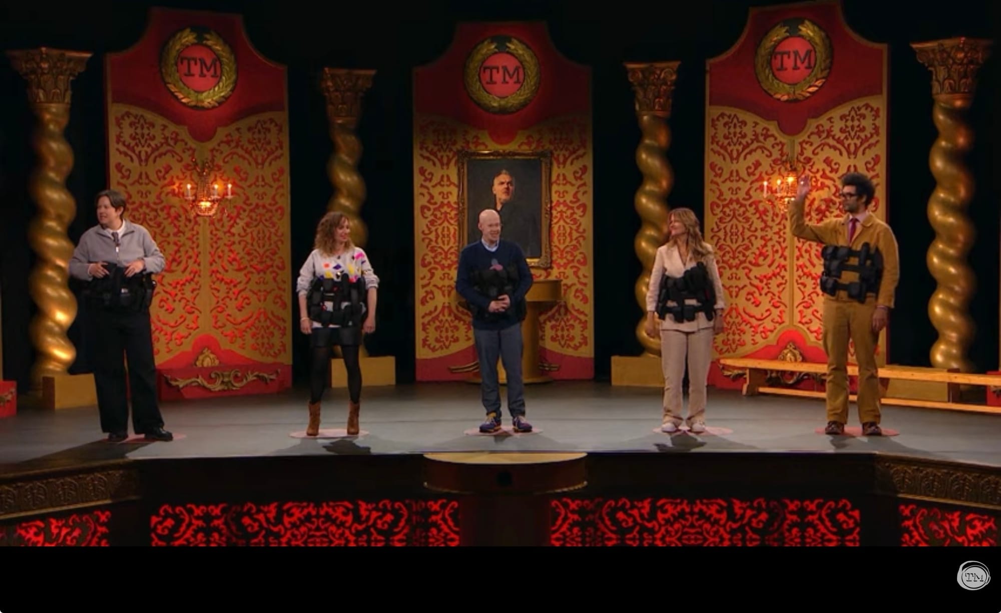 All five contestants on stage for the final task.
