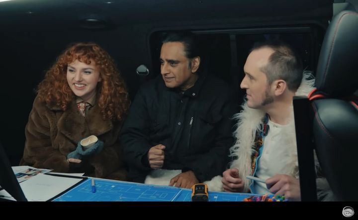 Ania Magliano, Sanjeev Bhaskar, and Phil Ellis sit in a van and plan a heist.