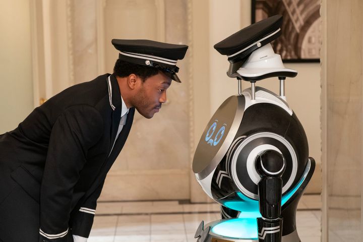 Jermain Fowler stares into the artificial eyes of a robot doorman
