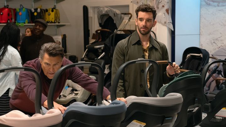 Ted McGinley and Michael Urie look at car seats.