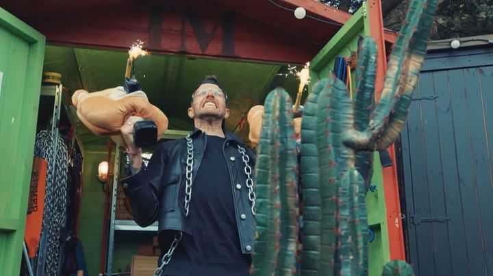 Joel Dommett wields drills with teddy bear faces that have sparklers in their mouths.