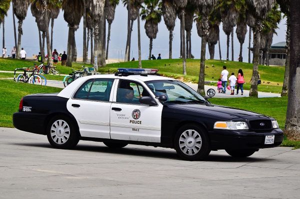 LAPD cruiser on a beach boardwalk. 