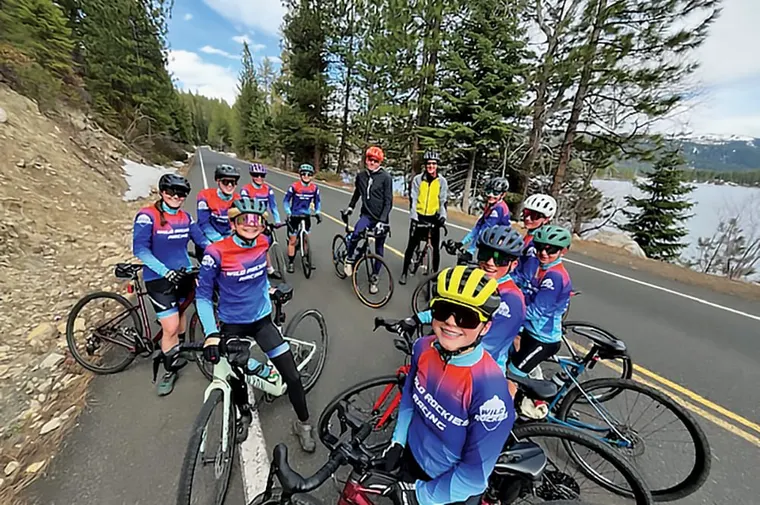 A group of people mountain biking around Payette Lake in McCall, ID.