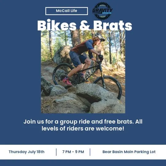 Photo is of a rider navigating rocks on a single track trail.