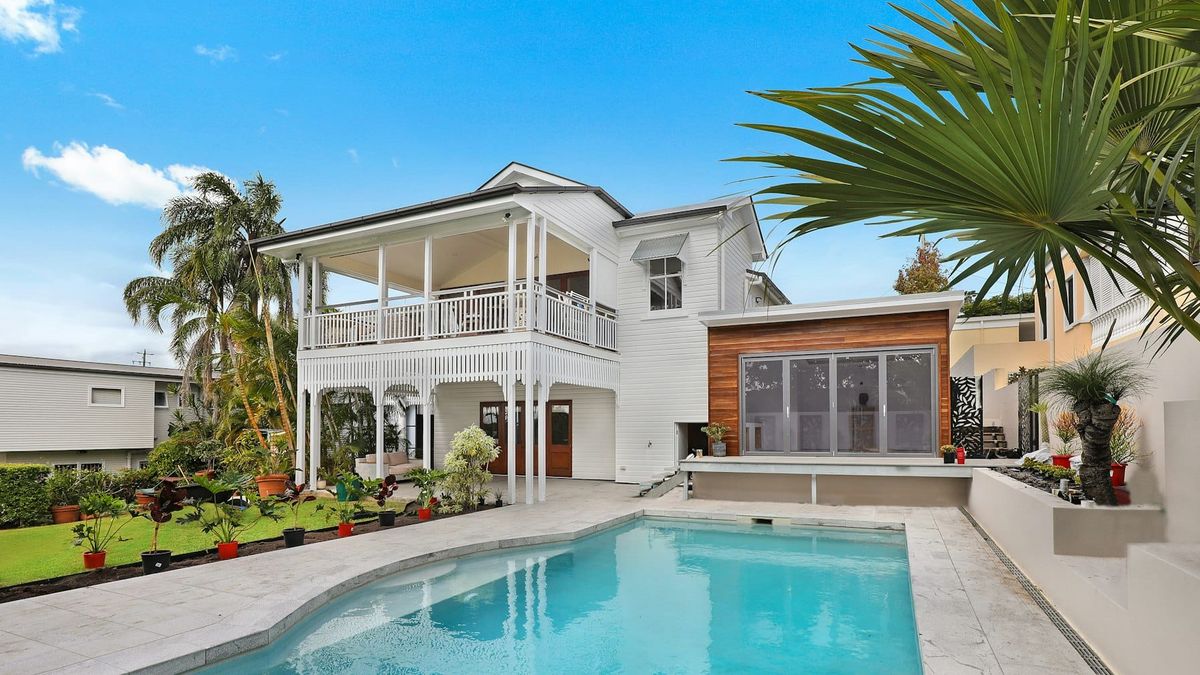 Modern coastal home exterior at golden hour