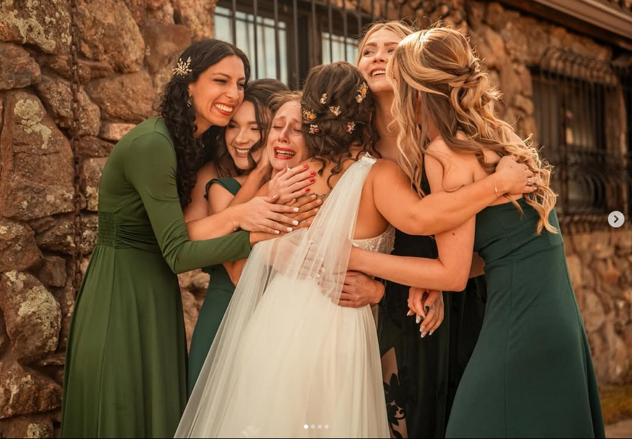 Example of an emotional wedding party photo captured by a professional wedding photographer.