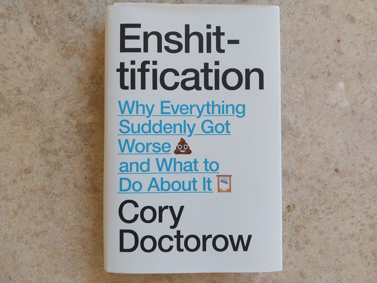 A book, seen against a concrete floor. The book is Enshittificantion by Cory Doctorow. The subtitle is "Why Everything Suddenly Got Worse and What to Do About It"