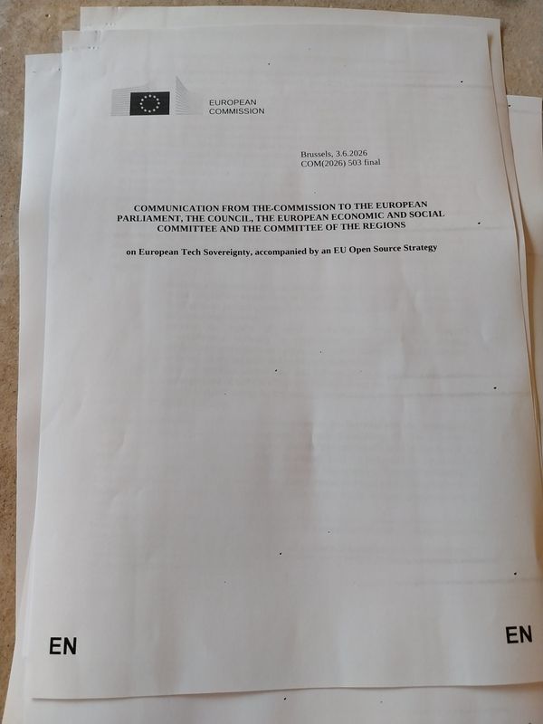 Photo of a stack of paper with a European Commission logo in the top-left corner and a very long title.