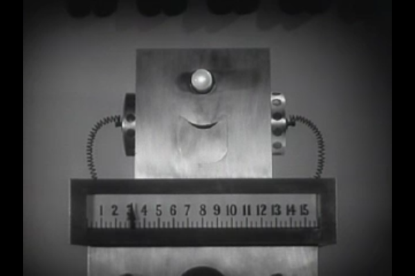 Black and white image of a smiling, very cuboid "robot."