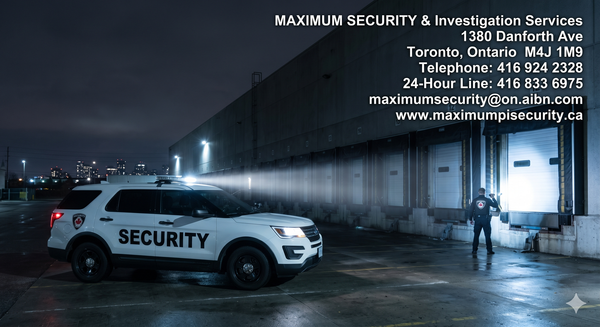 A marked commercial security vehicle parked outside a massive industrial warehouse loading dock in Mississauga at night, illuminating the rear shipping bay. Tag Industrial Security