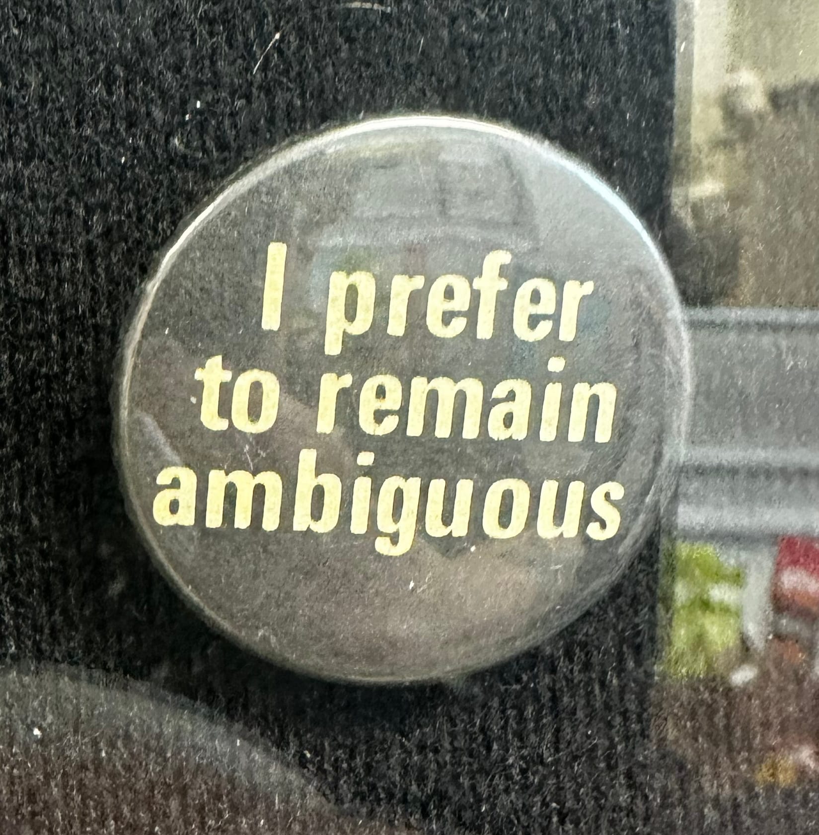 A pin reading "I prefer to remain ambiguous"