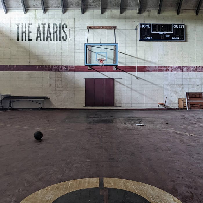 The cover of The Ataris' "Car Song" depicting an empty high school gymnasium with a basketball on the floor