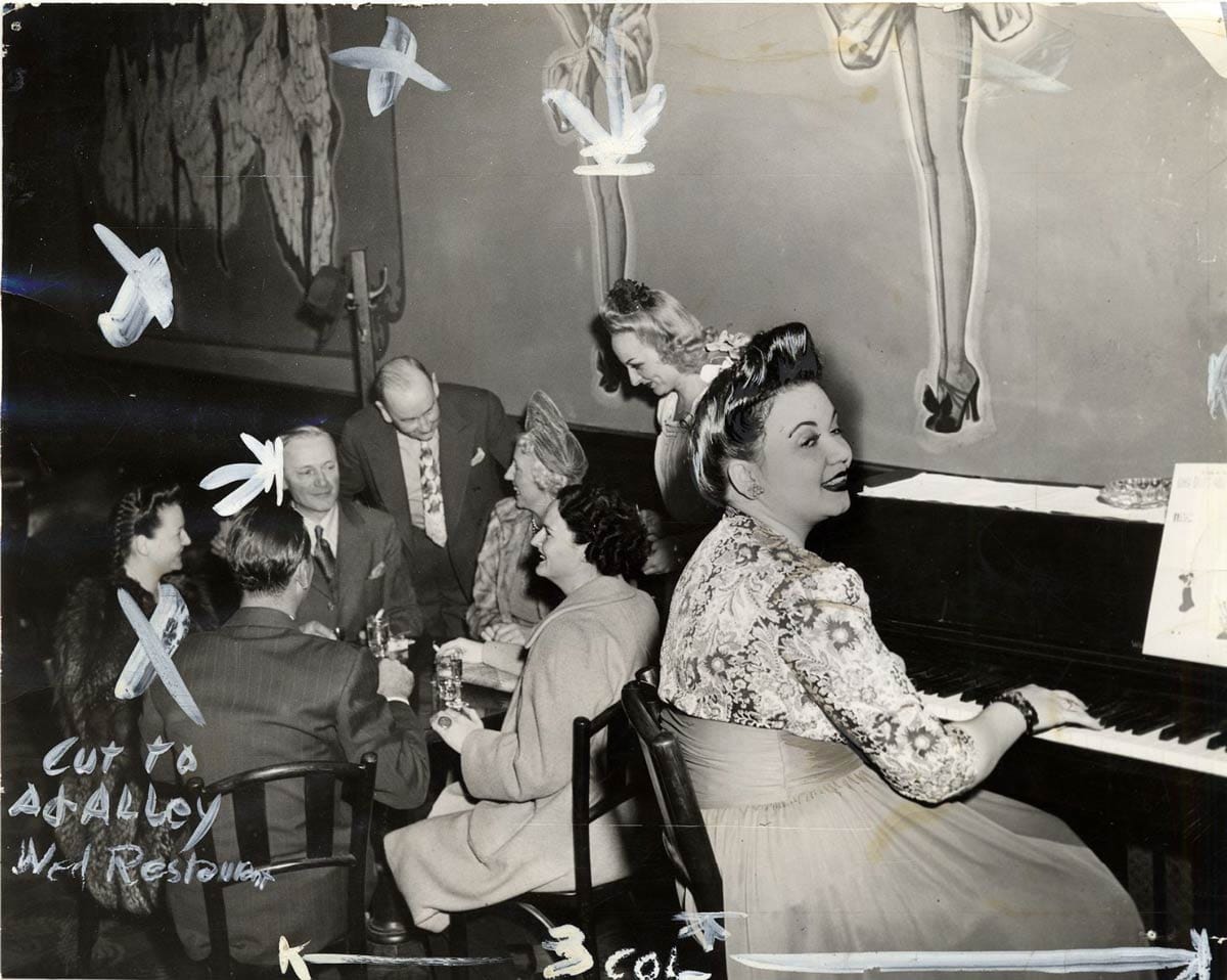 woman playing piano in House of Pisco