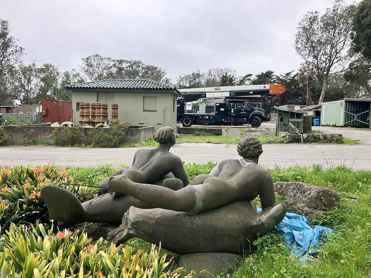 statues of boys on dolphins