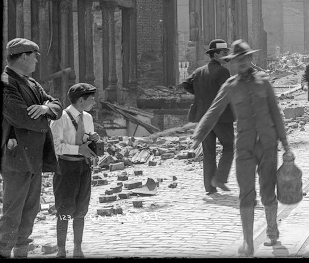 boy with camera after 1906 earthquake