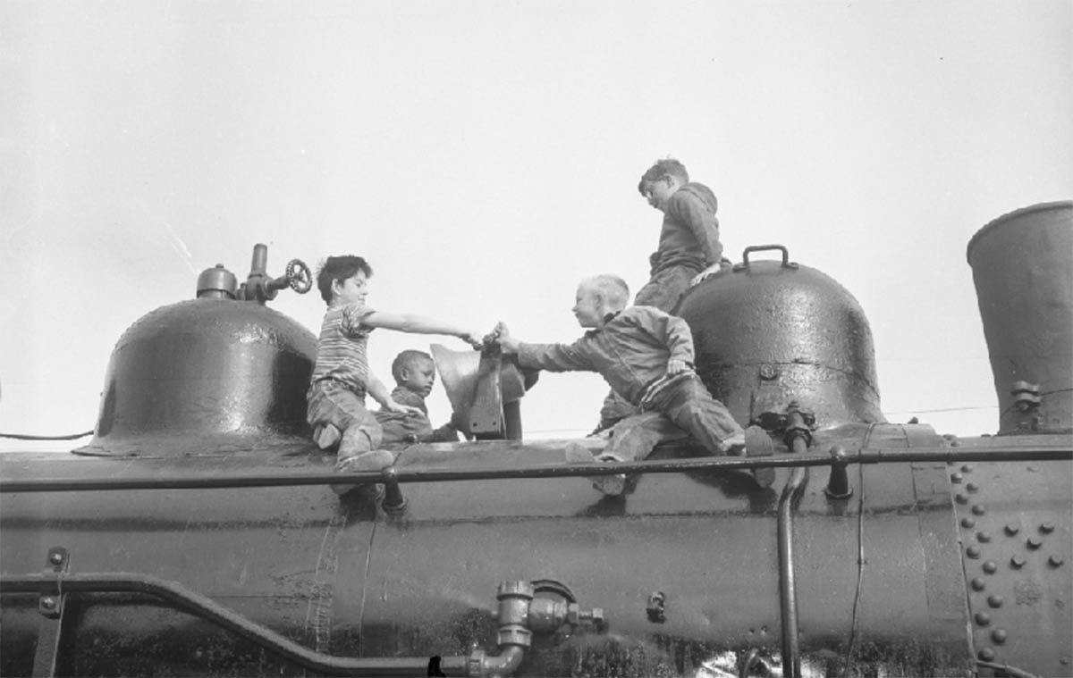 Boys ringing the bell of Engine #1294