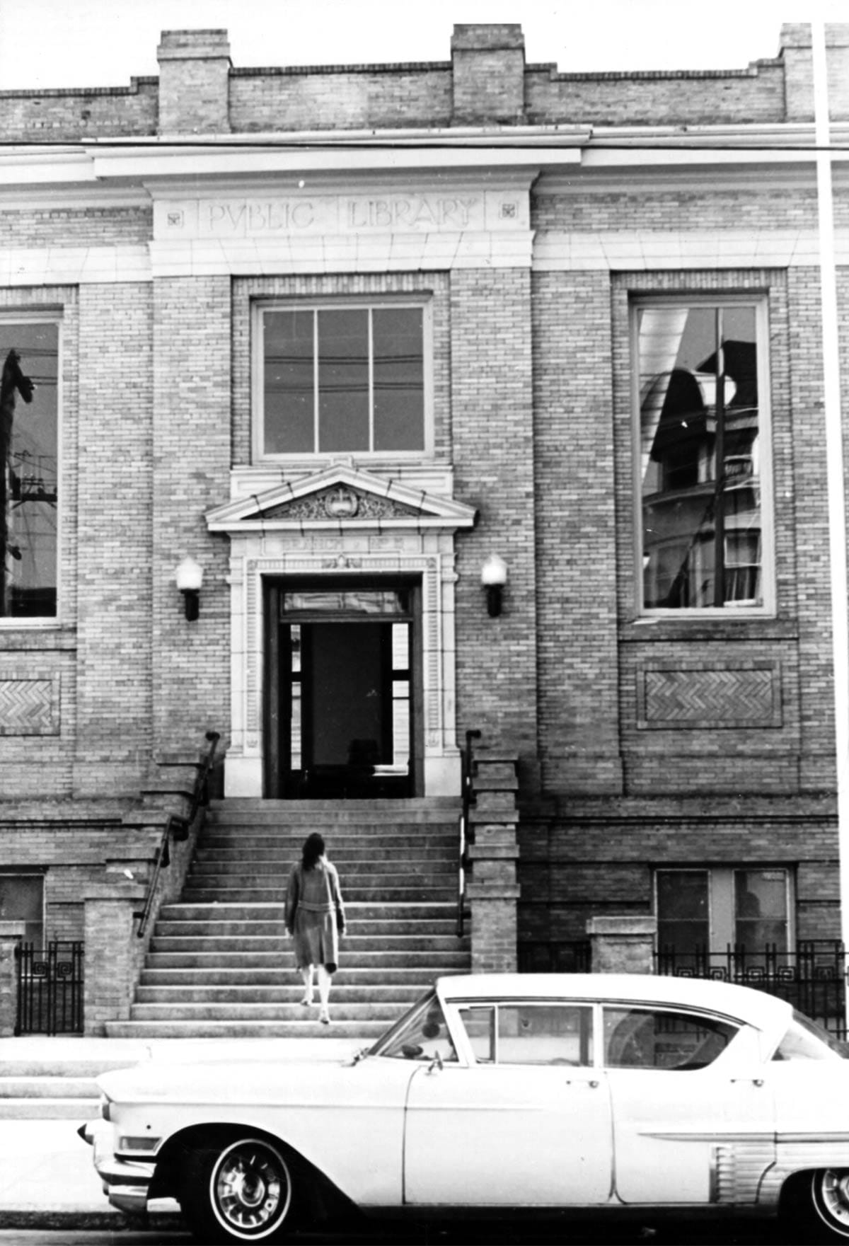 Woman approaching Park Branch library in 1970.