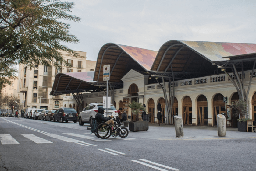 Wheelchair user crossing the street in Barcelona