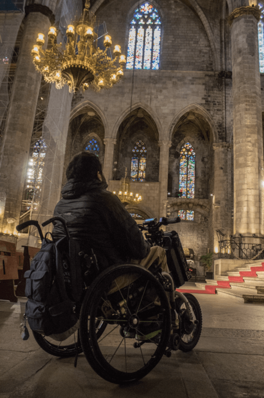 Wheelchair user looking up at Basilica of Santa María del Mar