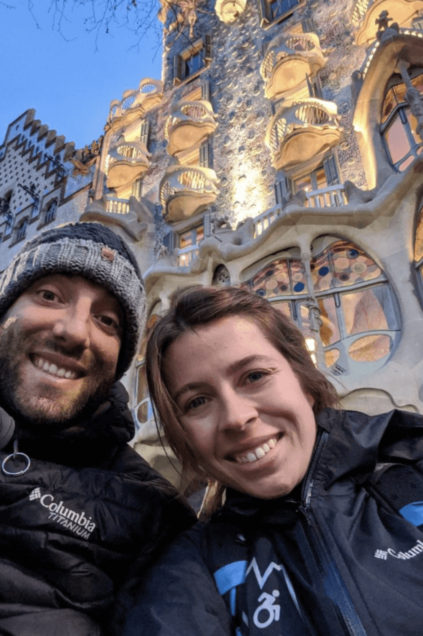 Wheelchair-user and companion smiling in Barcelona