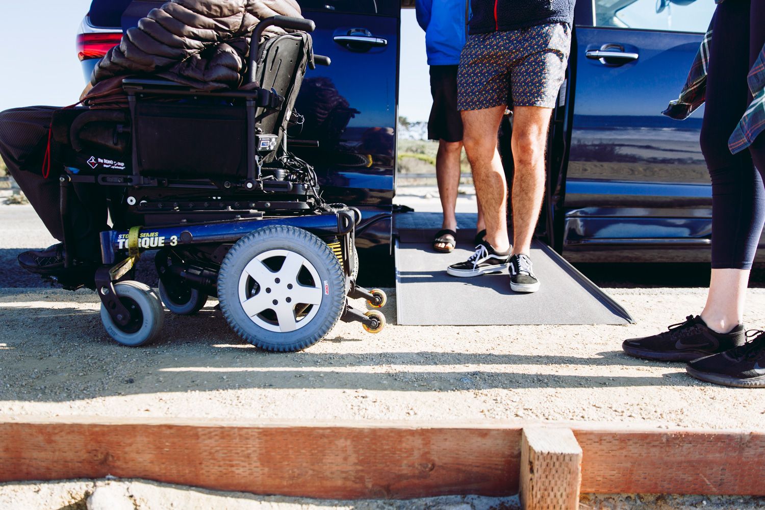 Wheelchair-user exiting a van with a ramp