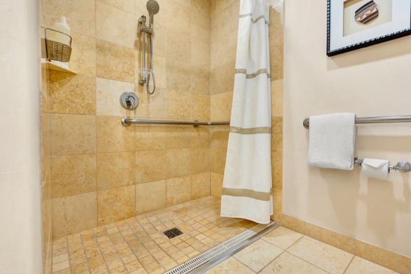 Roll-in shower with grab bars
