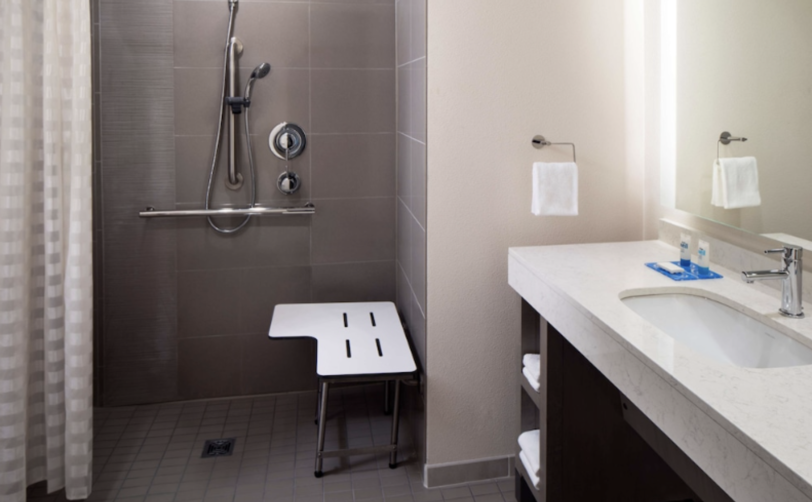 Roll-in shower with a seat at Hyatt House Tallahassee