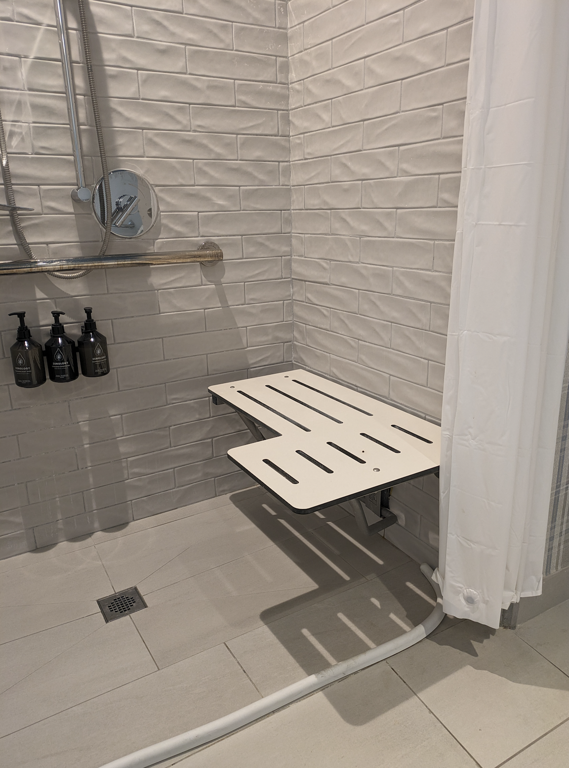 Roll-in shower with seat at Hotel Indigo Tallahassee