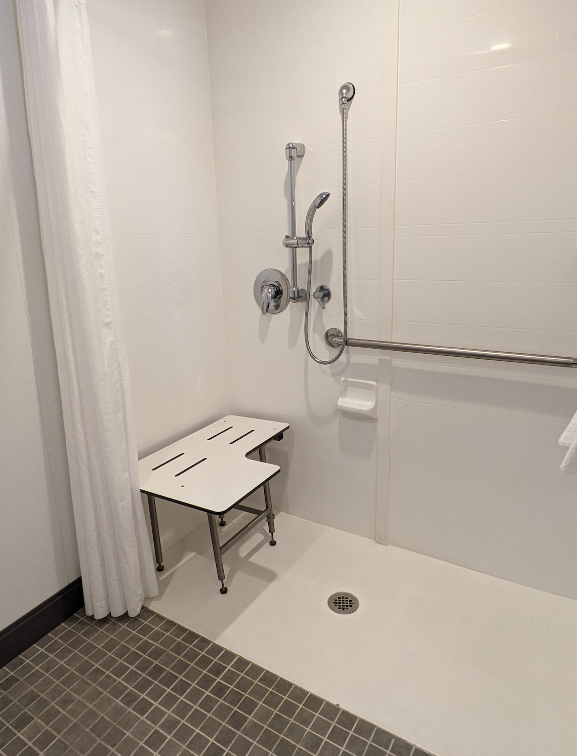 Roll-in shower with seat at Hampton Inn & Suites Tallahassee Capitol