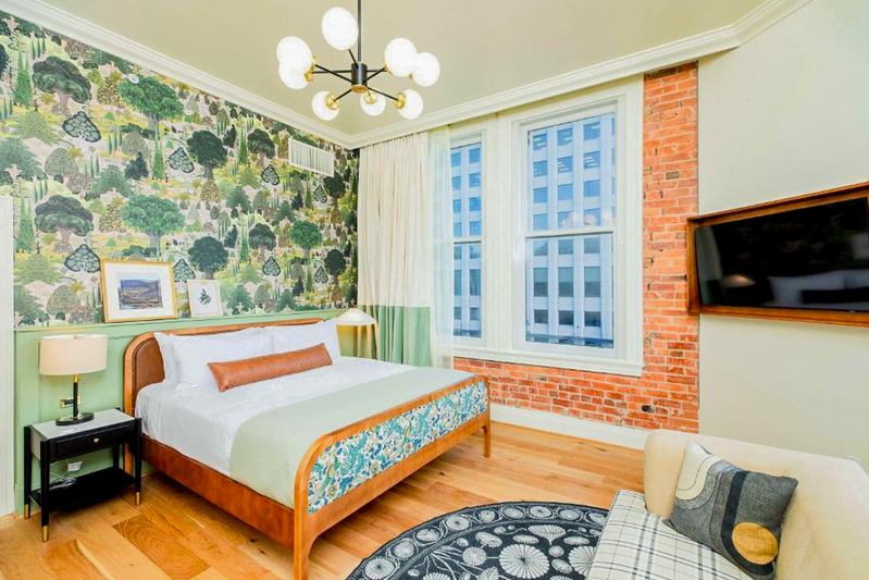 Quaint, spacious, and accessible bedroom at The Mining Exchange in Colorado Springs