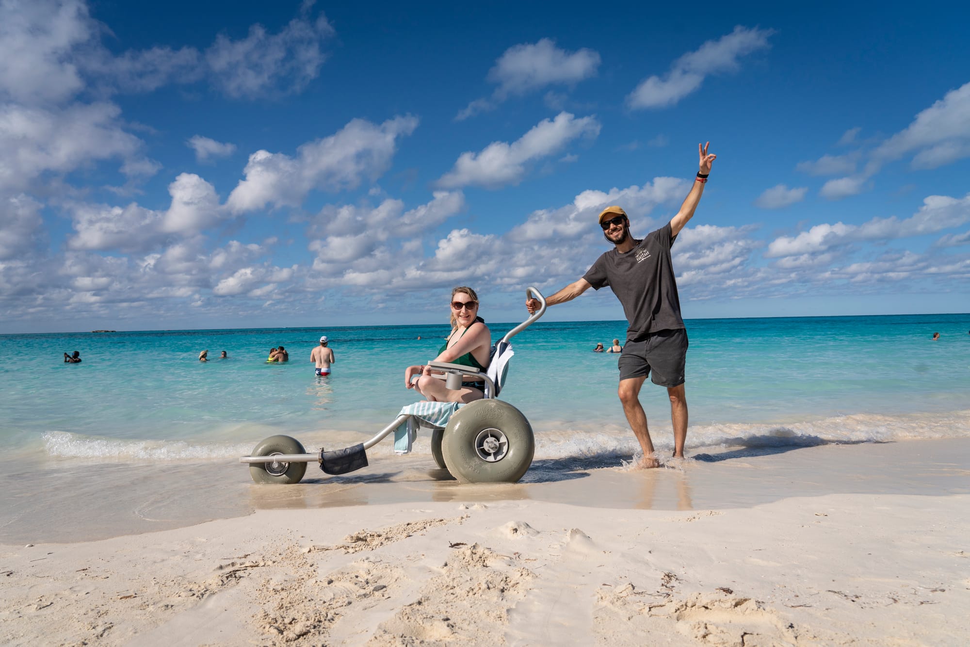 Beach wheelchair user enjoying the beach at Bimini Beach Club