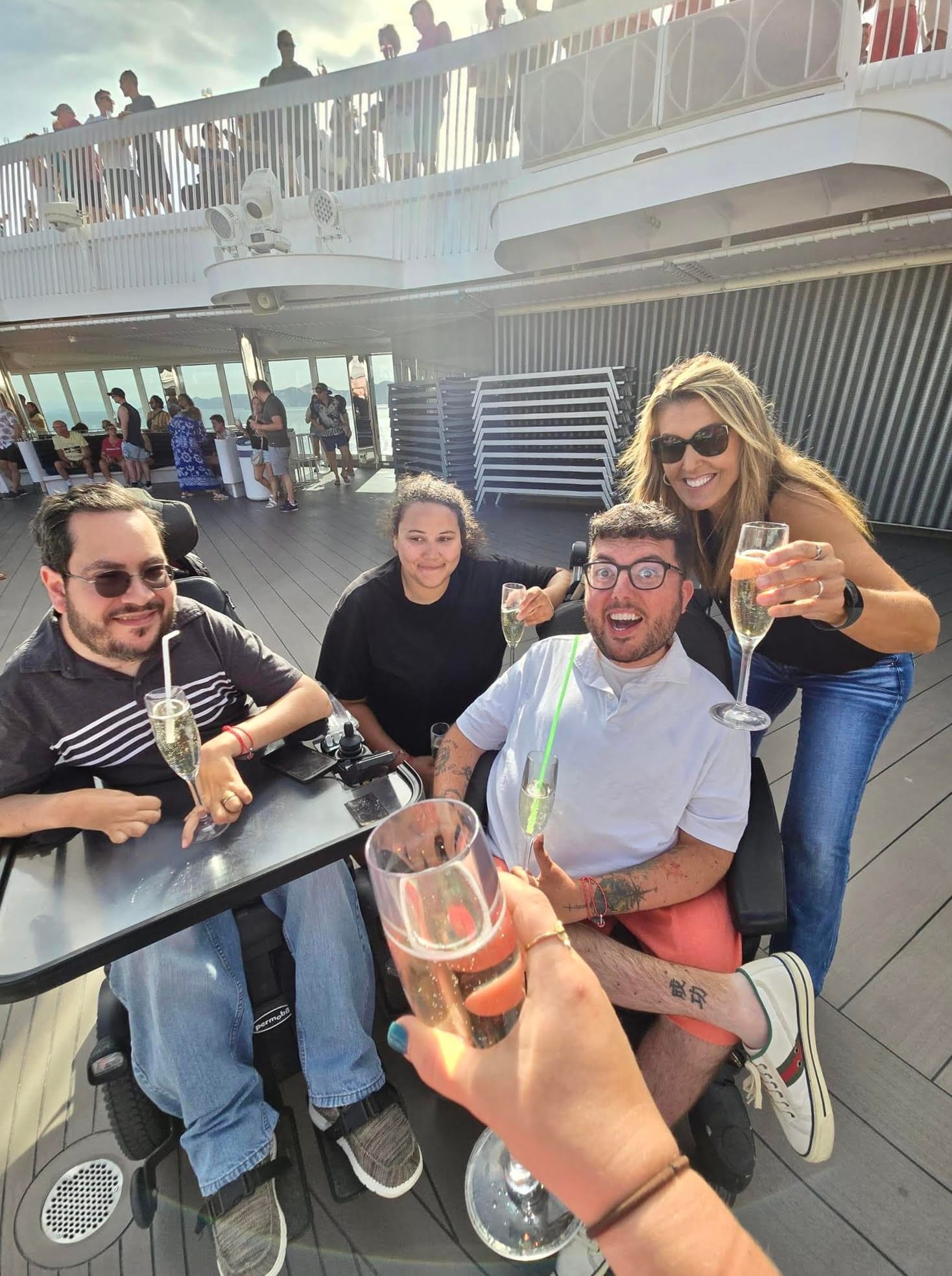 Cory Lee and friends enjoying drinks on a Virgin Voyages cruise
