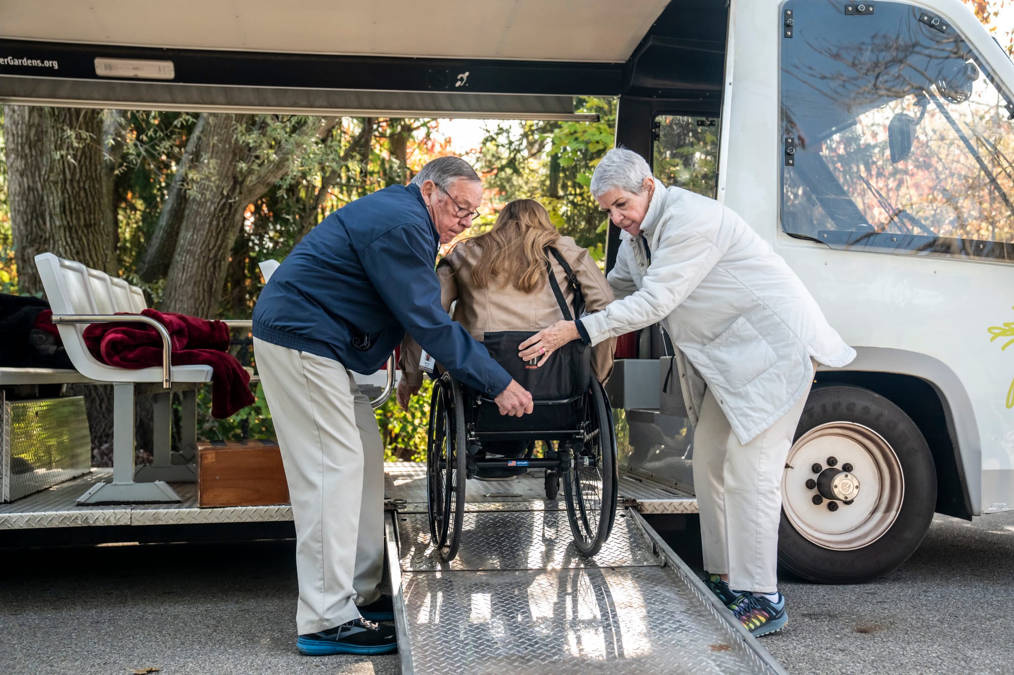 Wheelchair user going up ramp onto vehicle