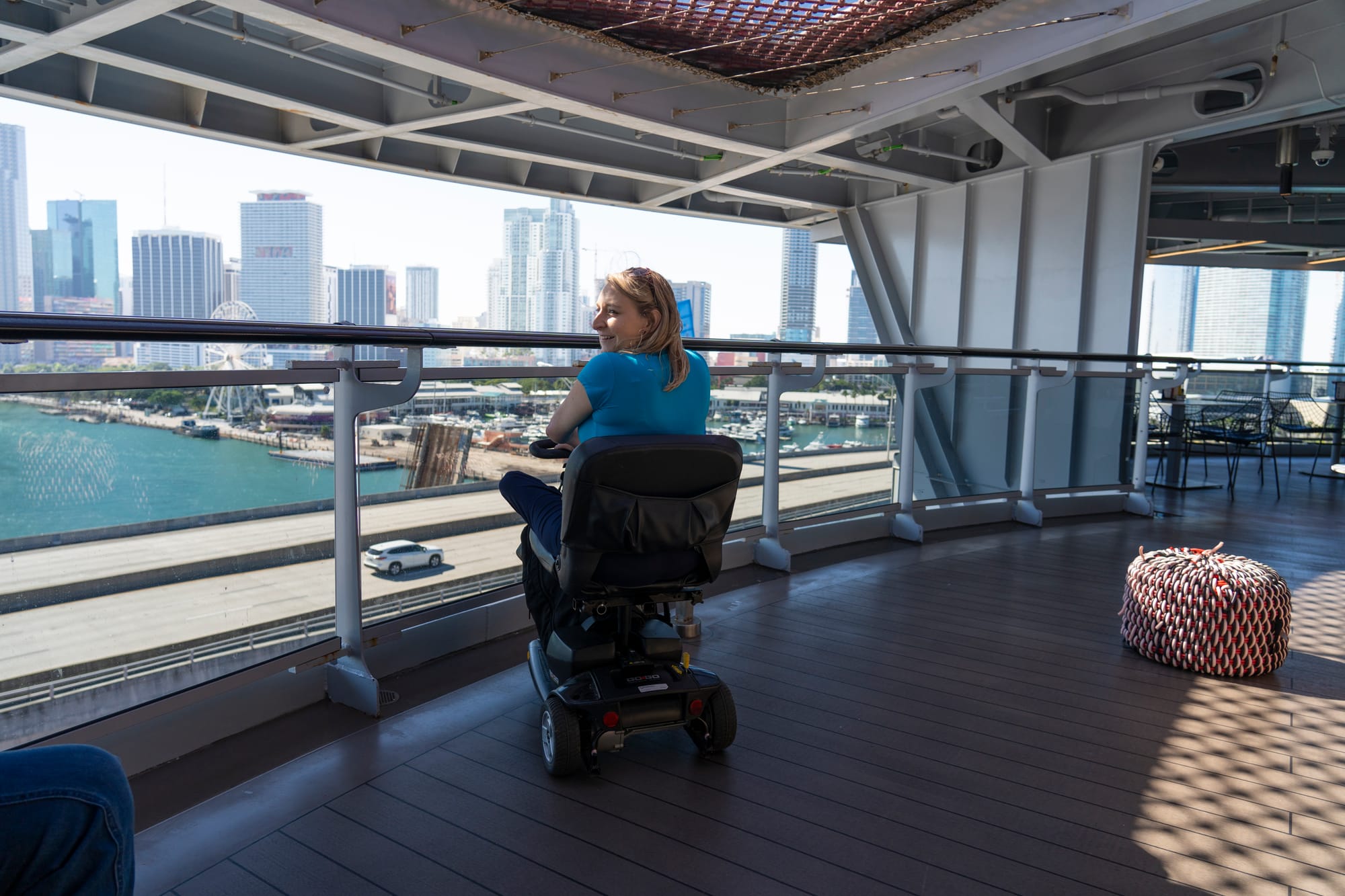 Wheelchair user enjoying the lookout on the Virgin Voyages cruise
