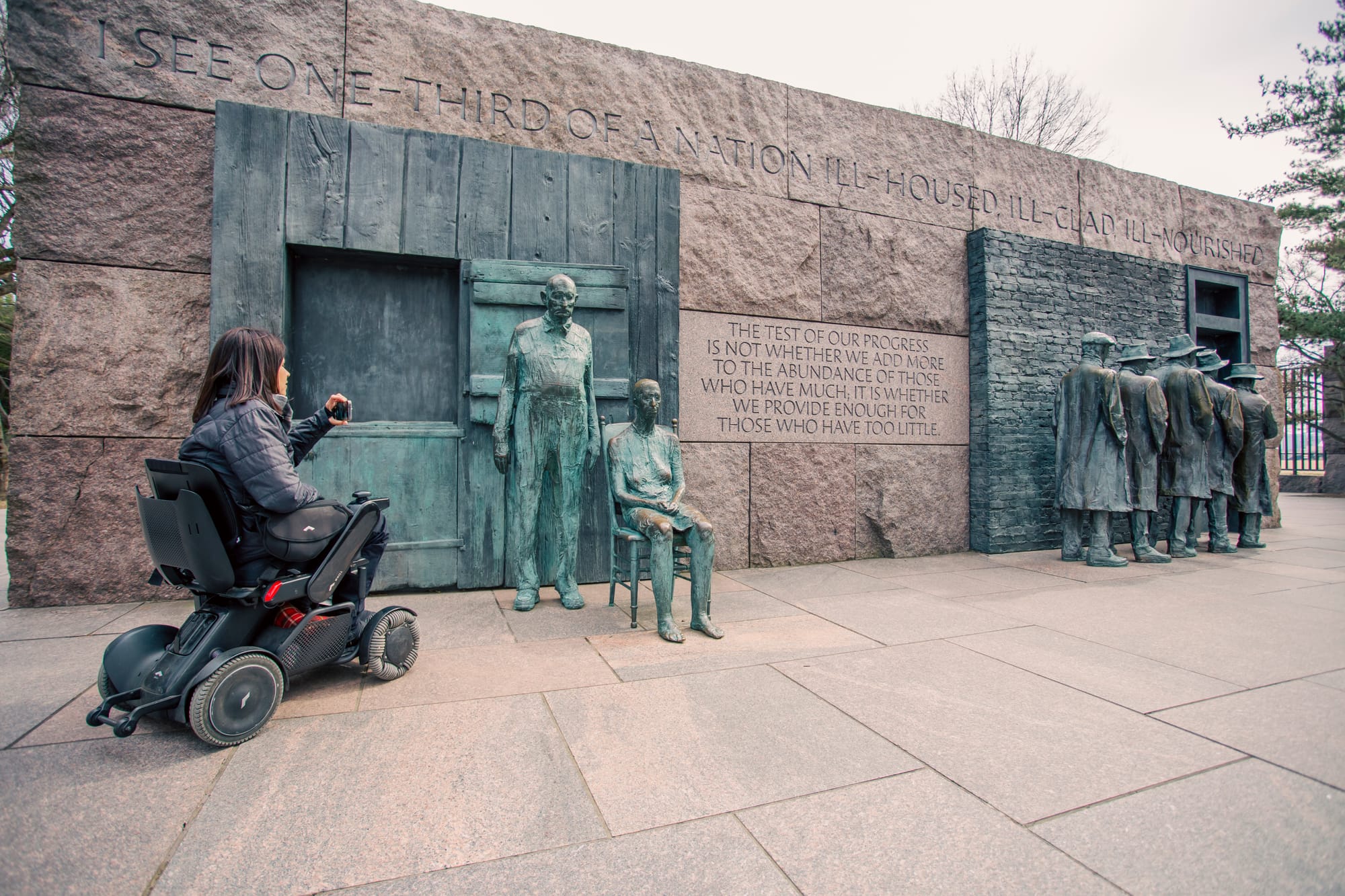 Wheelchair-user viewing FDR Memorial in Washington DC