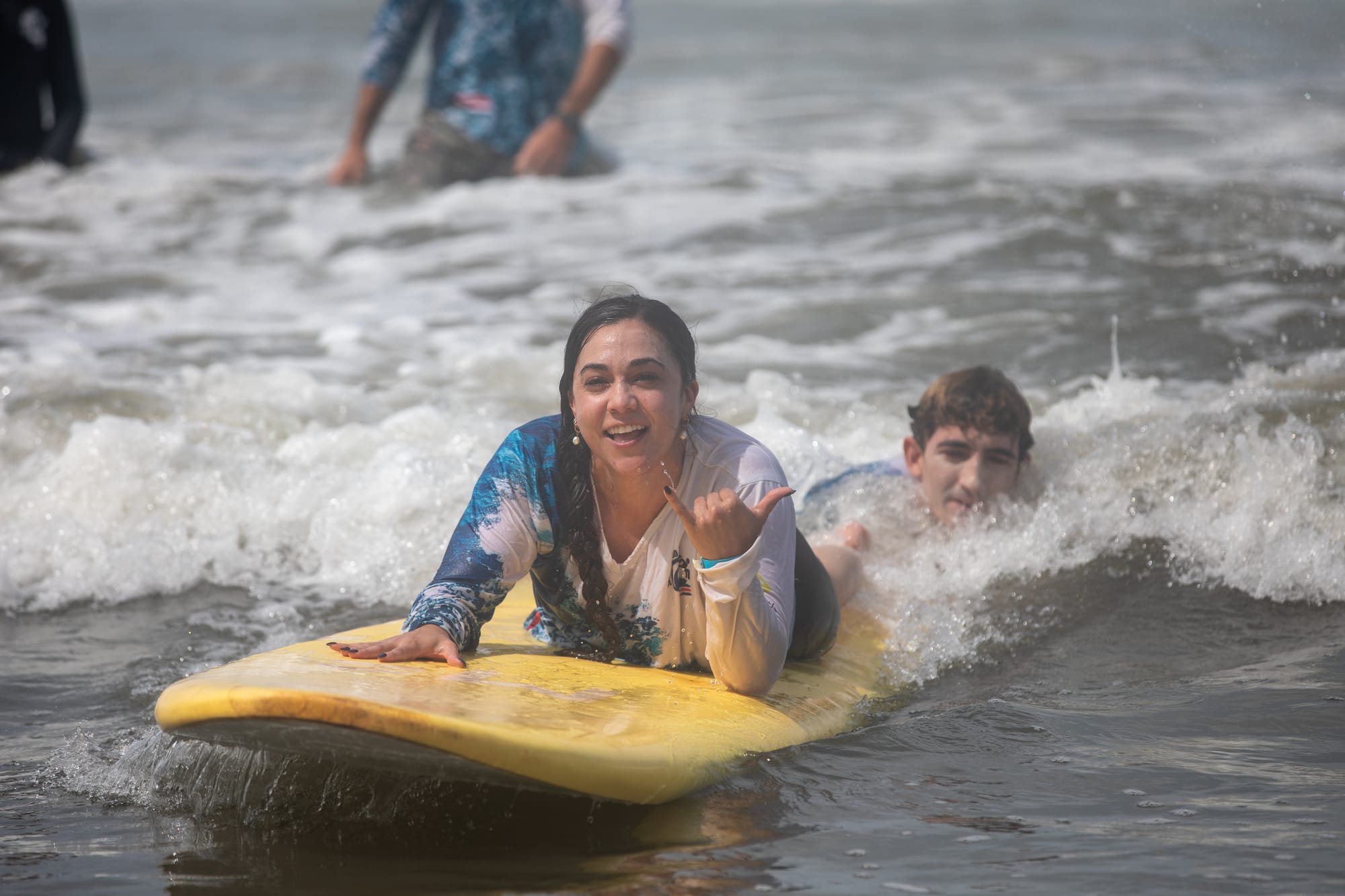 Wheelchair user trying adaptive surfing in Costa Rica