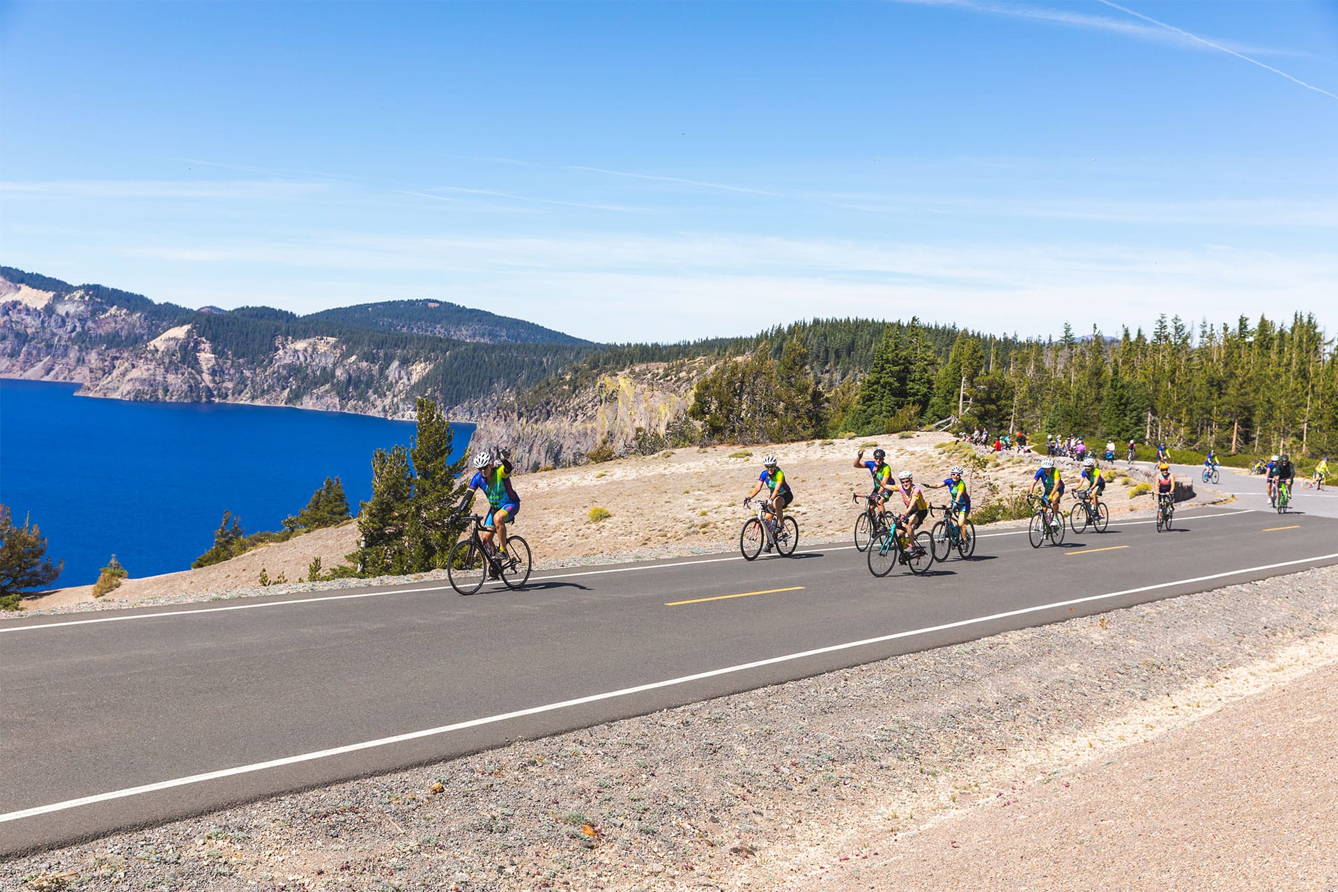 Group of cyclists going up Crater Lake National Park