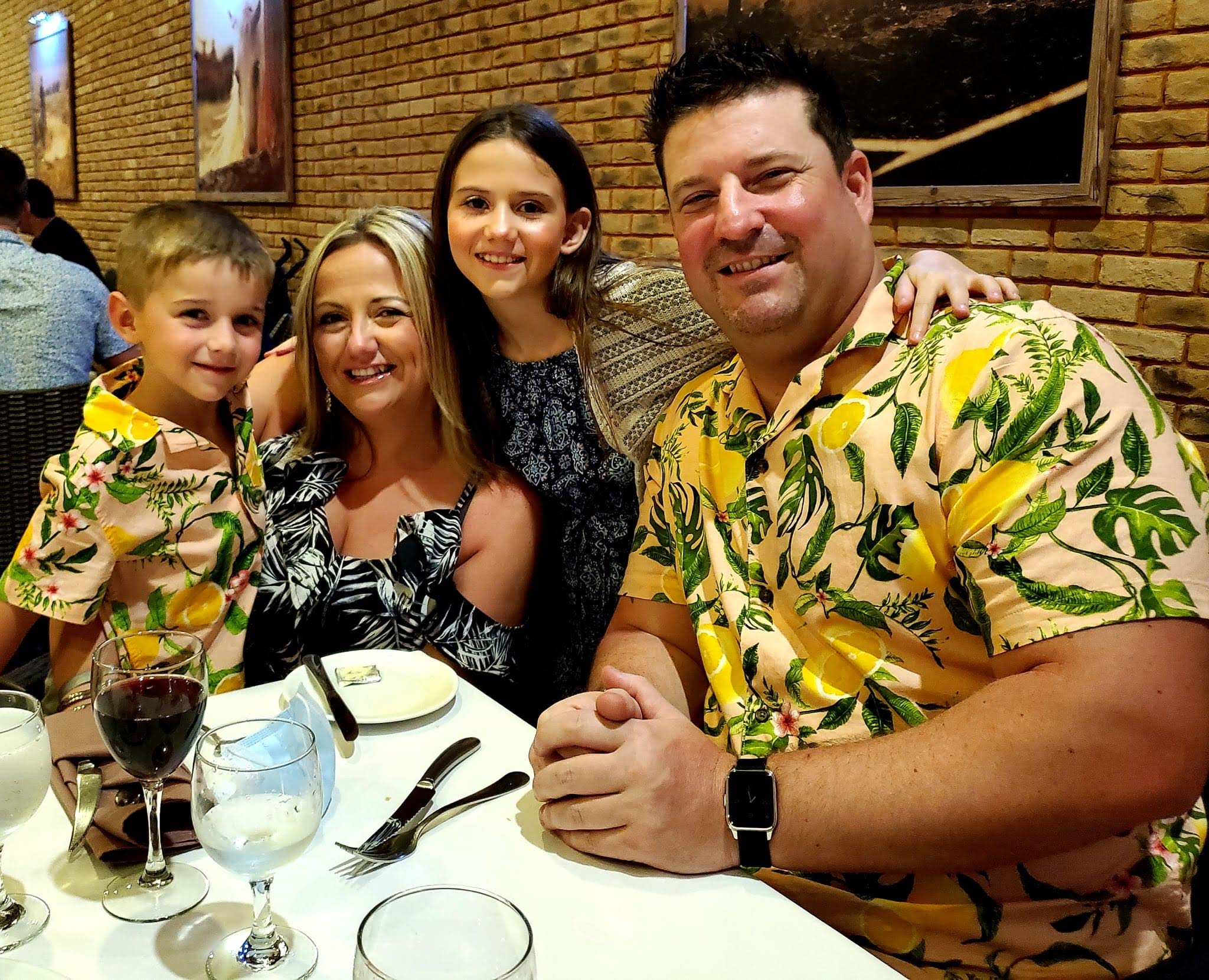 Wheelchair user and family at dinner on his vacation in Mexico